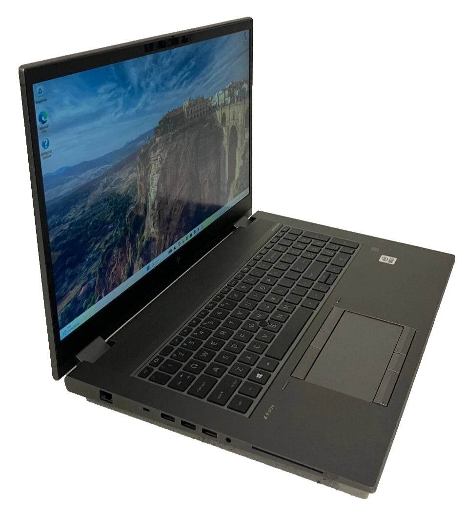 Black laptop with a scenic wallpaper on a white background