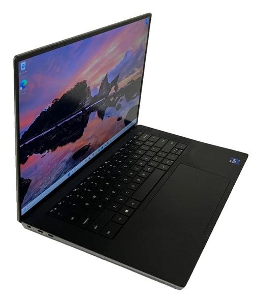Black laptop with a scenic wallpaper on a white background
