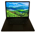 Black laptop with a scenic mountain view on the screen