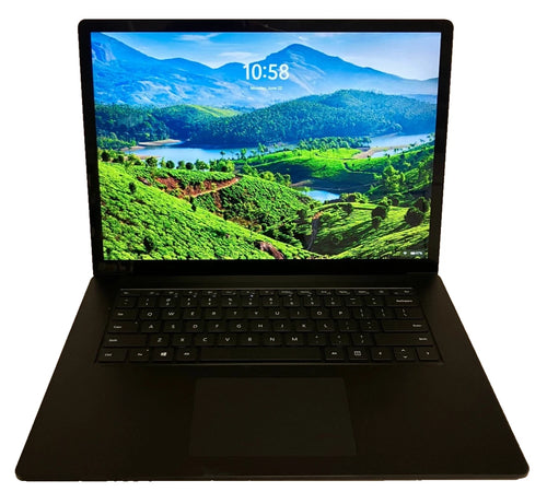 Black laptop with a scenic mountain view on the screen