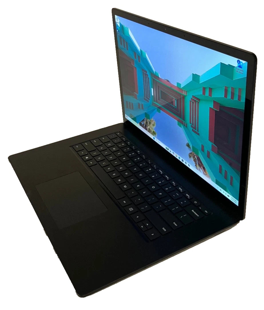 Black laptop with a red and green geometric background displayed on the screen.