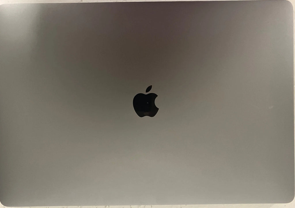 Back view of a laptop with Apple logo on a metallic surface