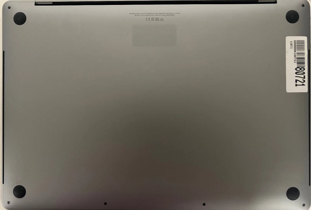 Back view of a laptop with a visible model number label.