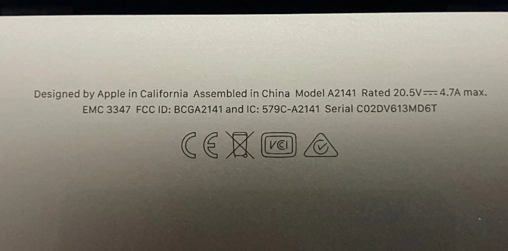 Back of a device with Apple branding, model information, and certification logos.