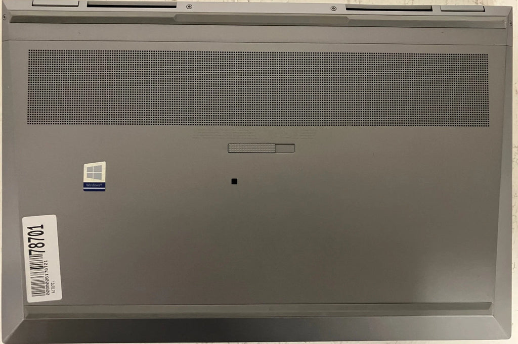 Bottom cover of a gray laptop with a visible brand logo on a white background