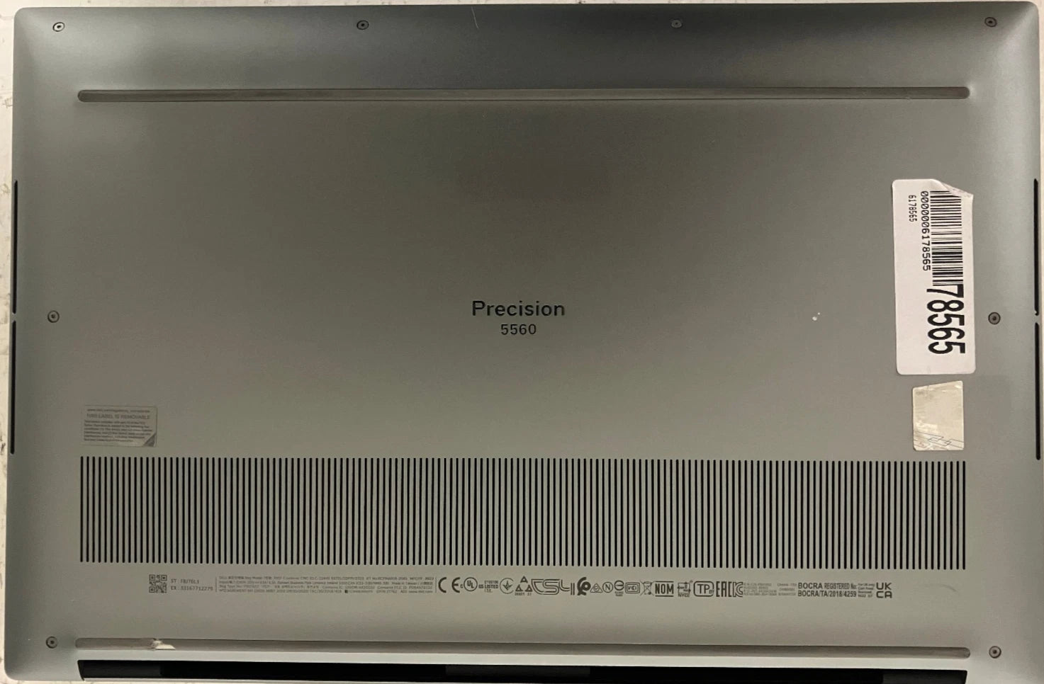 Back view of a laptop with 'Precision 5560' branding on a gray background
