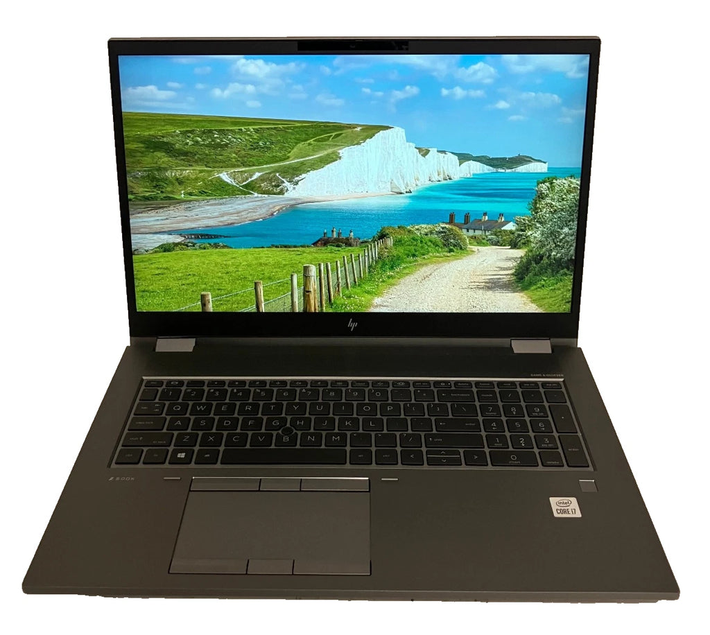 Laptop displaying a scenic view of a coastal landscape on a white background